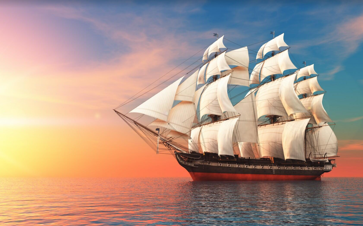 Segelfartyg i soluppgång/solnedgång