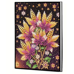 Notesbog med blomster i lilla og gyldne farver. Diamond painting.