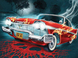 Diamond paint af rød klassisk amerikanerbil. Bilen er i flammer og baggrunden er dyster.