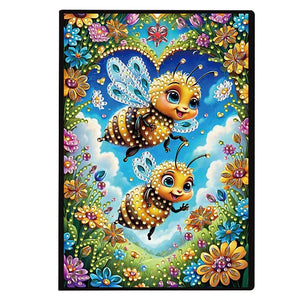 Diamond art notesbog med blomster og bier på forsiden. Farverig og glimtende.