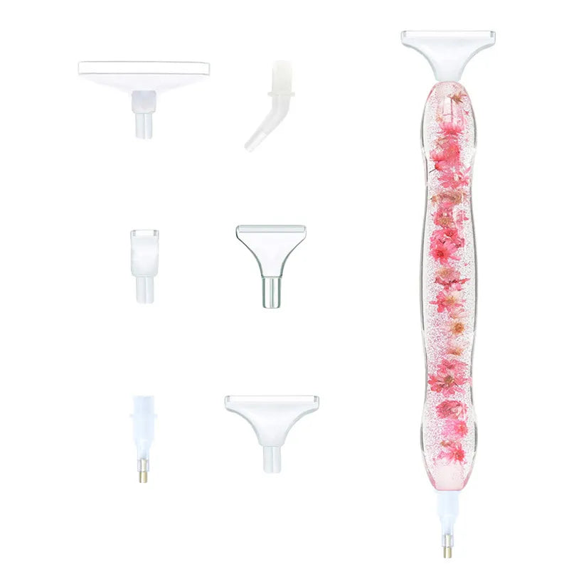 Gennemsigtig pen med tørret blomst i. Benyttes til diamond painting. Udskiftelige tipper.